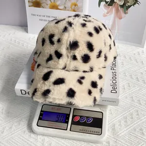 Detail shot showing a 90g weight of the plush leopard print baseball cap on a digital scale