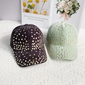 Fashionable ribbed velvet baseball caps with metallic studs in purple and mint green colors