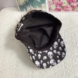 Detail of skull print baseball cap featuring brown wig hair and inner lining