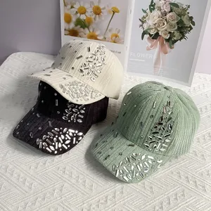 Detailed macro of velvet baseball caps with sparkling rhinestones in assorted colors