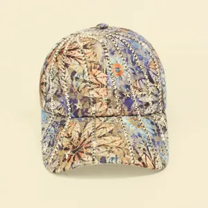 Detail of floral baseball cap with silver star rivets and glitter stripe accents