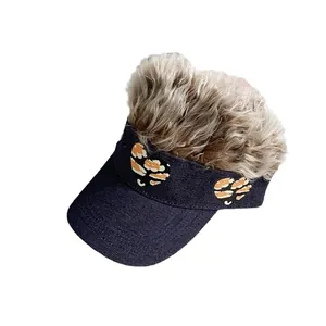 Denim baseball cap with brown fluffy wig hair and camouflage heart patches