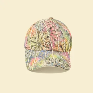 Detail of colorful baseball cap featuring rhinestone stripes and silver star metal rivets