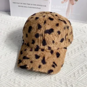 Detail of leopard print faux fur baseball cap with plush texture and warm material
