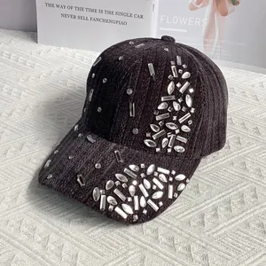 Detail of velvet baseball cap showing textured vertical ribs and sparkling rhinestones