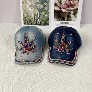 Denim baseball caps with colorful rhinestone leaf design and crystal brim accents