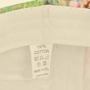 Detail shot of the internal 100% cotton material label on a sequin baseball cap
