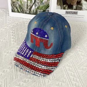 Detail view of the elephant logo and stars with rhinestones on a blue denim baseball cap