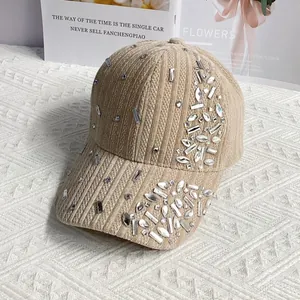 Detail of khaki corduroy baseball cap with sparkling rhinestones and ribbed texture