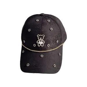 Black jacquard baseball cap with rhinestone bear motif and white heart detail for women