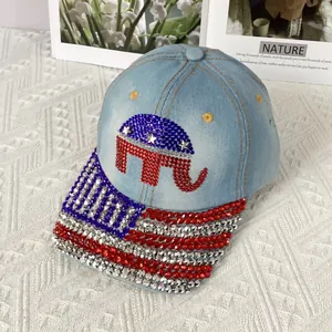 Close-up of rhinestone elephant logo and American flag pattern on denim baseball cap