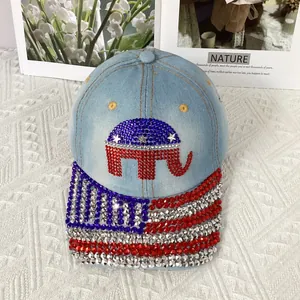 Close-up of sparkling rhinestone elephant and USA flag patterns on blue denim baseball cap