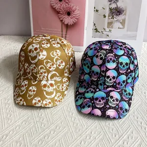 Detail view of cotton baseball caps featuring skull prints in brown and multicolor