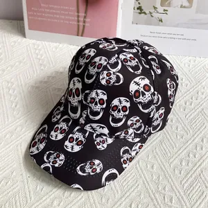 Close-up of skull printed baseball cap with red eye details on fabric background