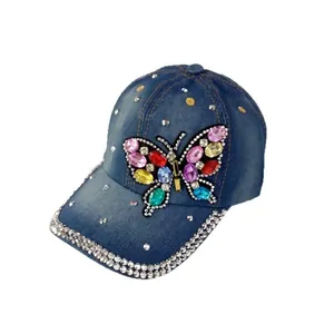 Navy blue denim baseball cap with colorful rhinestone butterfly and studded brim