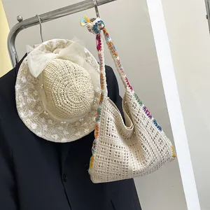 Handmade crochet shoulder bag with colorful floral embroidery and hollow knit design