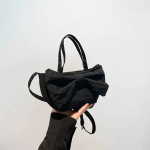 Sac à main noir en nylon avec grand nœud et bandoulière réglable pour femmes