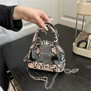 Transparente Mini-Schalentasche mit Zebra-Schlangenmuster und Metallkette