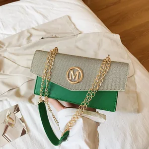 Green and beige patchwork crossbody bag with golden M logo and metal chain strap