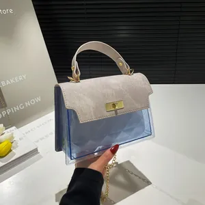 Chic women's crossbody bag with blue PVC quilting and grey suede lock closure
