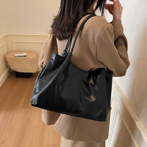 Large black pleated tote bag made of matte leather, perfect for daily office and school commute