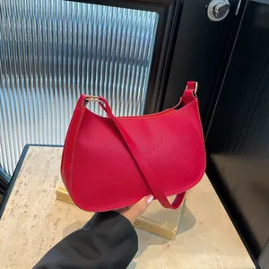 Elegant bright red textured leather hobo bag with gold hardware and shoulder strap