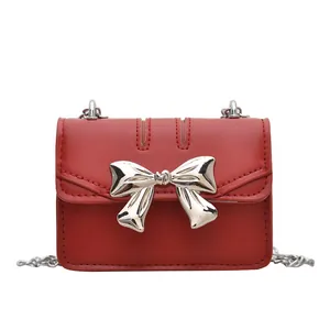 Vintage red girls mini square crossbody bag with large metallic silver bow and chain strap