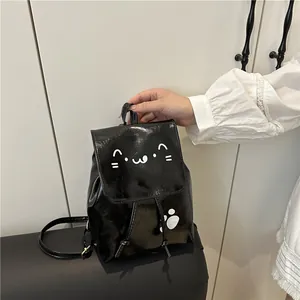 Minimalist black PU leather mini backpack featuring cute white cat face design and top handle