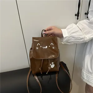Brown mini PU leather backpack with cartoon cat prints and adjustable shoulder straps