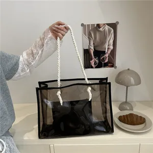 Sac fourre-tout transparent en PVC avec poignées en corde et pochette noire amovible