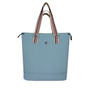 Light blue large capacity tote bag with colorful striped handles and drawstring sides