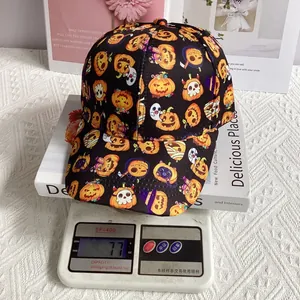 Close-up of Halloween baseball cap showing a 77g weight measurement on a digital scale