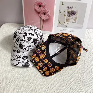 Halloween baseball caps with pumpkin and bat prints on white and black fabric