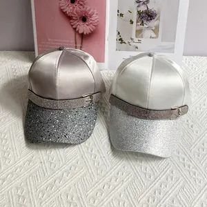 Elegant satin baseball caps with rhinestone belt buckles and glitter brims in two colors