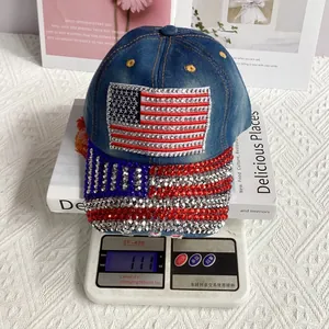 Detail showing denim baseball cap weight of 111g with rhinestone American flag design