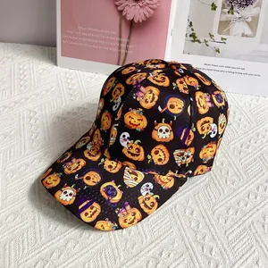 Detailed view of Halloween baseball cap with ghosts and pumpkin prints on white desk