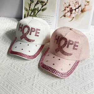 White and pink baseball caps with rhinestone HOPE letters and stylish ribbon details