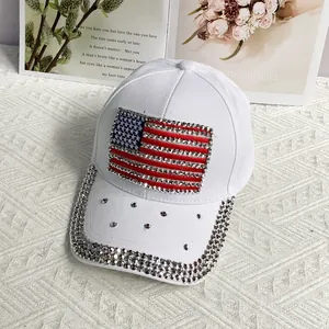 Detail of shimmering rhinestones on a white baseball cap with US flag motif