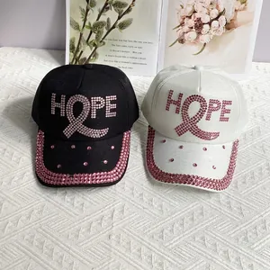 Black and white baseball caps with pink rhinestones HOPE lettering and ribbon logo