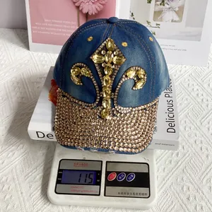 Detail showing the weight of 115g for a rhinestone studded denim baseball cap