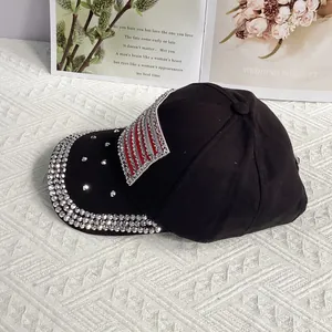 Detail of black baseball cap with rhinestone edges and American flag shield patch
