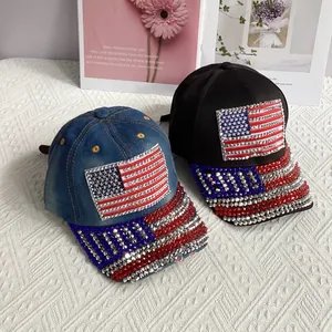 Denim and black baseball caps featuring sparkling rhinestone US flag patterns on front