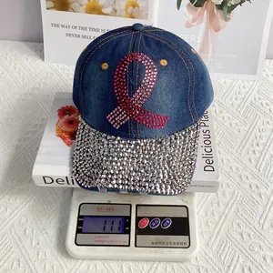 Detail shot of a denim baseball cap with rhinestones on a scale weighing 111 grams
