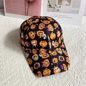 Detailed view of Halloween baseball cap featuring cartoon ghosts and pumpkin prints