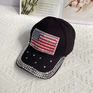 Detailed close-up of sparkling rhinestone US flag patch on a black cotton baseball cap