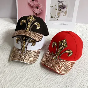 Denim baseball cap with gold rhinestone brim and large sparkling fleur-de-lis emblem