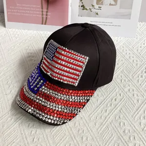 Close-up of sparkling rhinestone US flag pattern on a black denim baseball cap