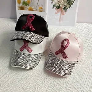 Satin denim baseball cap with pink rhinestone ribbons and sparkling brim for women