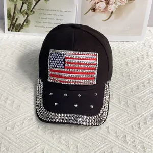 Detail of black baseball cap with rhinestone American flag patch and studded brim trim
