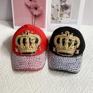 Fashionable crown baseball cap with gold sequins and pearl studded brim in red and black